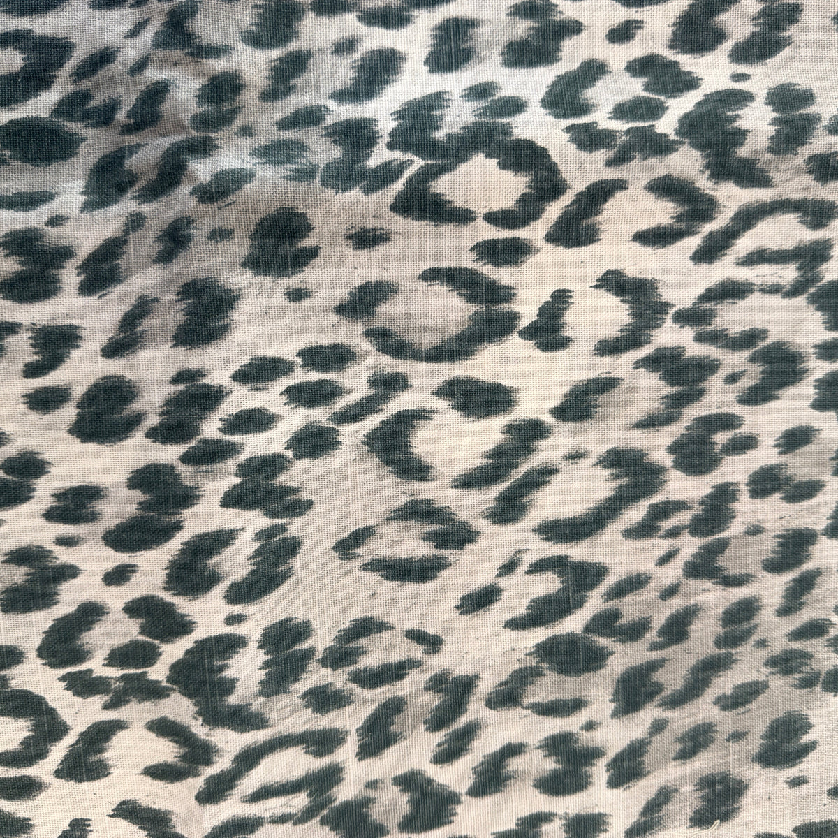 Kravet Bosana shadow leopard ikat printed on natural linen
